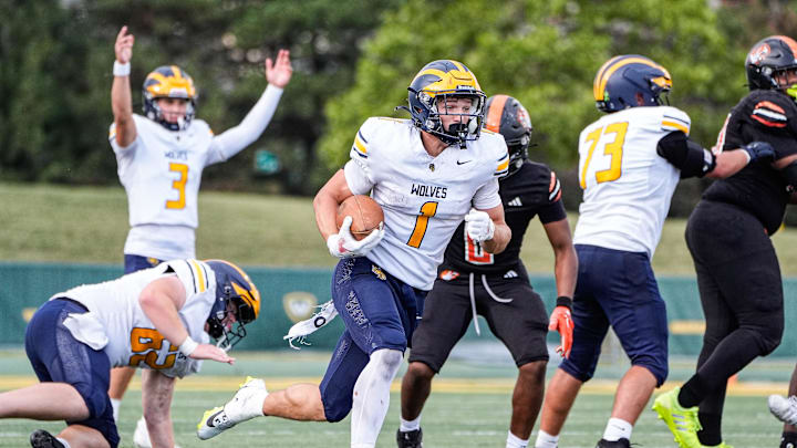 Clarkston running back Lucas Bowman (1) runs for a touchdown against Belleville during the second half of Prep Kickoff Classic at Wayne State University' Adams Field in Detroit on Thursday, August 28, 2025.