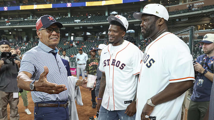 Jul 30, 2024; Houston, Texas, USA; Reggie Jackson (left) talks with Andre Johnson (middle) and rapper 50 cent (right) before the game between the Houston Astros and the Pittsburgh Pirates at Minute Maid Park. Mandatory Credit: Troy Taormina-Imagn Images Jul 30, 2024; Houston, Texas, USA; Reggie Jackson (left) talks with Andre Johnson (middle) and rapper 50 cent (right) before the game between the Houston Astros and the Pittsburgh Pirates at Minute Maid Park. Mandatory Credit: Troy Taormina-Imagn Images
