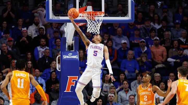 Jan 7, 2025; Gainesville, Florida, USA; Florida Gators guard Will Richard (5) makes a layup against the Tennessee Volunteers during the first half at Exactech Arena at the Stephen C. O'Connell Center. Mandatory Credit: Matt Pendleton-Imagn Images