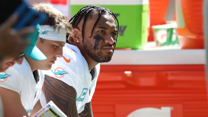 Miami Dolphins quarterback Tua Tagovailoa (1) on the bench during the second half against the Indianapolis Colts at Lucas Oil Stadium. 