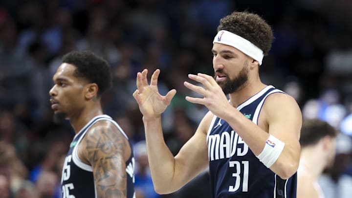 Oct 31, 2024; Dallas, Texas, USA;  Dallas Mavericks guard Klay Thompson (31) reacts in fron tof Dallas Mavericks forward P.J. Washington (25) during the second half against the Houston Rockets at American Airlines Center. Mandatory Credit: Kevin Jairaj-Imagn Images