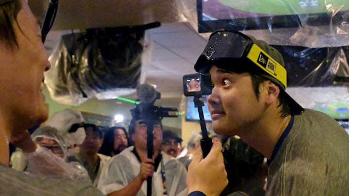Los Angeles Dodgers designated hitter Shohei Ohtani and pitcher Yoshinobu Yamamoto celebrate in the clubhouse after defeating the New York Mets in the NLCS.