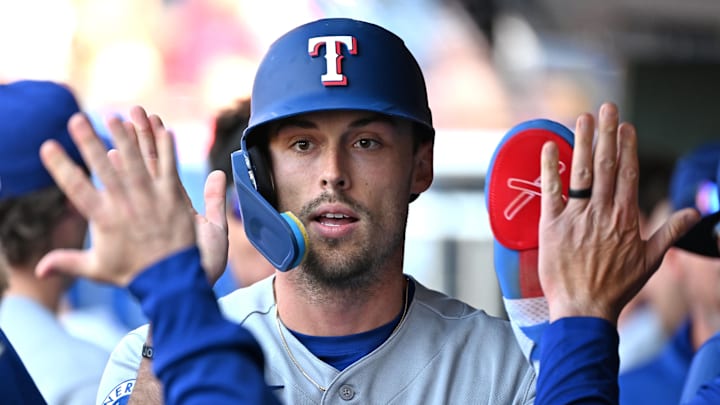Mar 29, 2026; Philadelphia, Pennsylvania, USA; Texas Rangers center fielder Evan Carter (32) celebrates in the dugout after scoring a run against the Philadelphia Phillies during the seventh inning at Citizens Bank Park. Mandatory Credit: Eric Hartline-Imagn Images