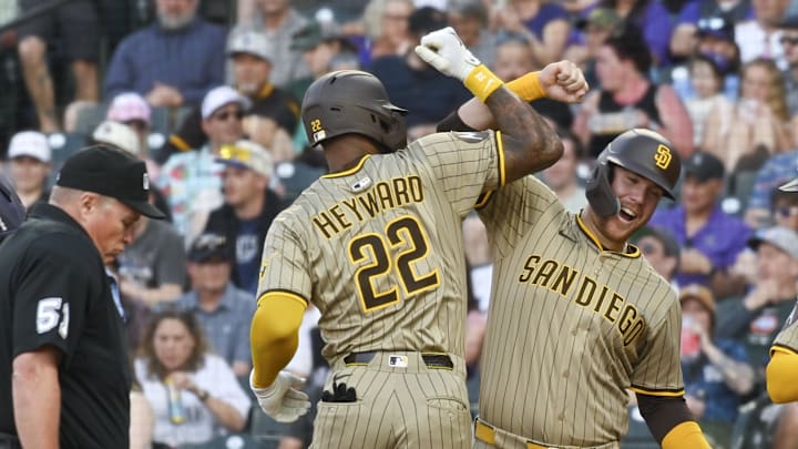 May 10, 2025; Denver, Colorado, USA; San Diego Padres outfielder Jason Heyward (22) is congratulated by first baseman Gavin Sheets (30) after his home run during the fourth inning against the Colorado Rockies  at Coors Field. Mandatory Credit: John Leyba-Imagn Images
