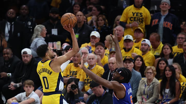 May 27, 2025; Indianapolis, Indiana, USA; Indiana Pacers guard Tyrese Haliburton (0) drives to the hoop past New York Knicks forward Precious Achiuwa (5) during the first quarter of game four of the eastern conference finals for the 2025 NBA Playoffs at Gainbridge Fieldhouse. Mandatory Credit: Trevor Ruszkowski-Imagn Images