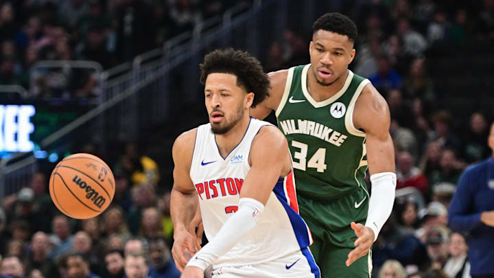 Dec 16, 2023; Milwaukee, Wisconsin, USA;  Detroit Pistons guard Cade Cunningham (2) is guarded by Milwaukee Bucks forward Giannis Antetokounmpo (34) in the first quarter at Fiserv Forum. Mandatory Credit: Benny Sieu-Imagn Images