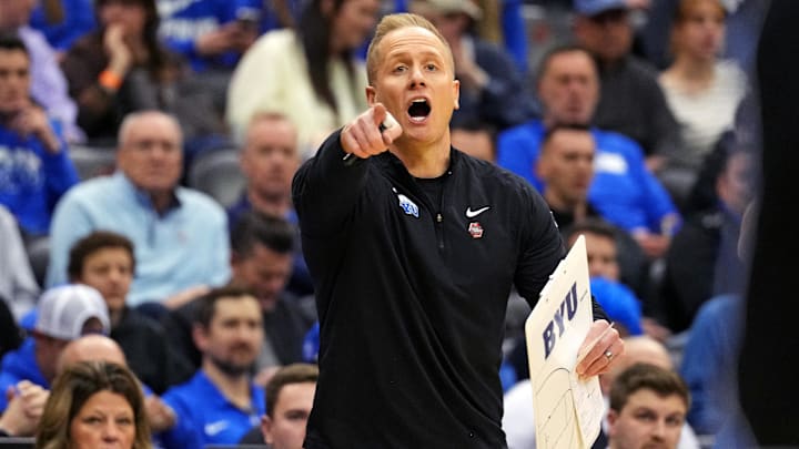Mar 27, 2025; Newark, NJ, USA; Brigham Young Cougars head coach Kevin Young calls to his team during the first half against the Alabama Crimson Tide during an East Regional semifinal of the 2025 NCAA tournament at Prudential Center. Mandatory Credit: Robert Deutsch-Imagn Images Mar 27, 2025; Newark, NJ, USA; Brigham Young Cougars head coach Kevin Young calls to his team during the first half against the Alabama Crimson Tide during an East Regional semifinal of the 2025 NCAA tournament at Prudential Center. Mandatory Credit: Robert Deutsch-Imagn Images
