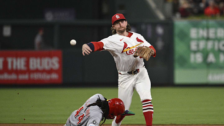 Sep 16, 2025; St. Louis, Missouri, USA; Cincinnati Reds shortstop Elly De La Cruz (44) is out at second base as St. Louis Cardinals second baseman Brendan Donovan (33) turns a double play in the fifth inning at Busch Stadium. Mandatory Credit: Joe Puetz-Imagn Images