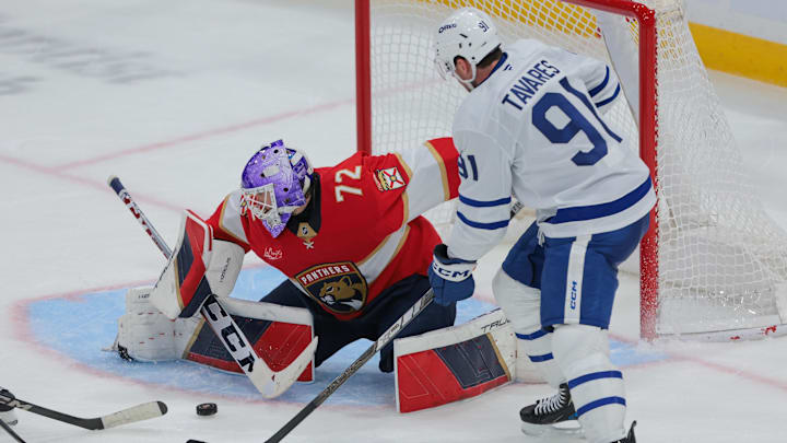Nov 27, 2024; Sunrise, Florida, USA; Florida Panthers goaltender Sergei Bobrovsky (72) makes a save against Toronto Maple Leafs center John Tavares (91) during the third period at Amerant Bank Arena. Mandatory Credit: Sam Navarro-Imagn Images