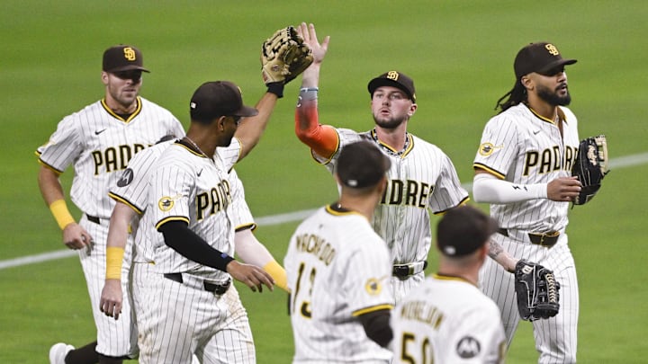 May 12, 2025; San Diego, California, USA; San Diego Padres center fielder Jackson Merrill (3), center, is congratulated after making a defensive play during the seventh inning against the Los Angeles Angels at Petco Park. Mandatory Credit: Denis Poroy-Imagn Images