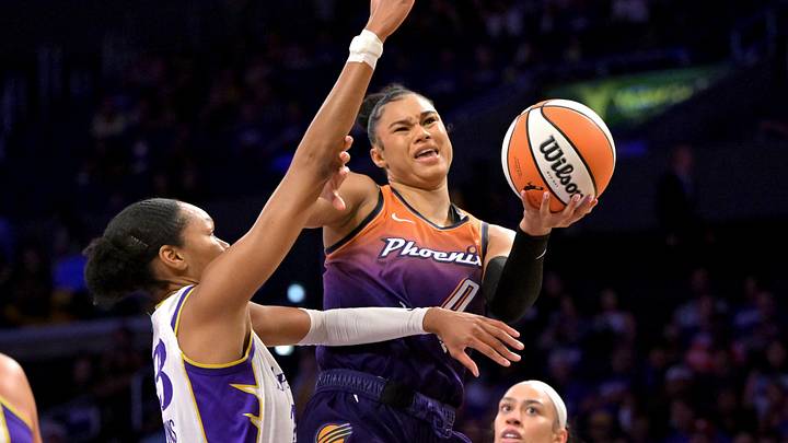 Aug 26, 2025; Los Angeles, California, USA;  Phoenix Mercury forward Satou Sabally (0) is defended by Los Angeles Sparks forward Azura Stevens (23) as she drives to the basket during the first half at Crypto.com Arena. Mandatory Credit: Jayne Kamin-Oncea-Imagn Images
