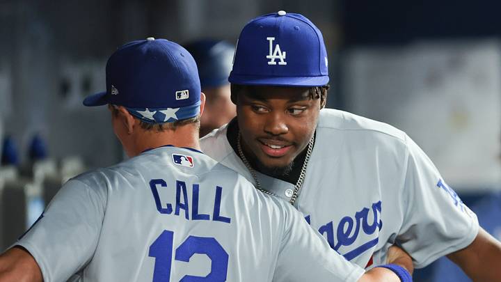 Sep 11, 2026; Miami, Florida, USA; Los Angeles Dodgers designated hitter Josue De Paula (95) and left fielder Alex Call (12) hug before the game against the Miami Marlins at loanDepot Park. Mandatory Credit: Sam Navarro-Imagn Images