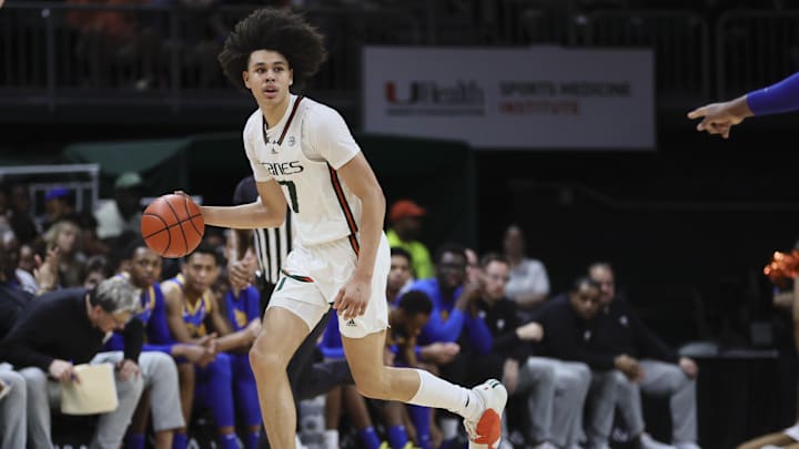 Jan 27, 2024; Coral Gables, Florida, USA; Miami Hurricanes guard Kyshawn George (7) dribbles the
