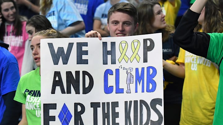A Penn State Nittany Lions fan holds a sign for the THON fundraiser prior to the game against the Rutgers Scarlet Knights at the Bryce Jordan Center. A Penn State Nittany Lions fan holds a sign for the THON fundraiser prior to the game against the Rutgers Scarlet Knights at the Bryce Jordan Center.