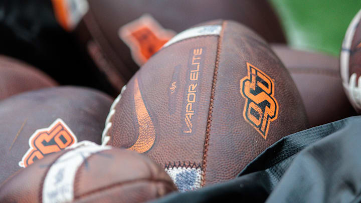 Nov 2, 2024; Stillwater, Oklahoma, USA; Oklahoma State Cowboys footballs on the side lines before a game against the Arizona State Sun Devils at Boone Pickens Stadium. Mandatory Credit: William Purnell-Imagn Images