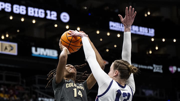 Mar 7, 2025; Kansas City, MO, USA; TCU Horned Frogs center Sedona Prince (13) blocks a shot by Colorado Buffaloes forward Jade Masogayo (14) during the third quarter at T-Mobile Center. Mandatory Credit: Amy Kontras-Imagn Images