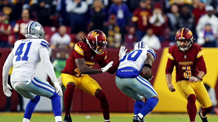 Nov 24, 2024; Landover, Maryland, USA; Dallas Cowboys safety Juanyeh Thomas (30) recovers an onside kick by Washington Commanders place kicker Austin Seibert (3) and returns it for a touchdown during the fourth quarter at Northwest Stadium. Mandatory Credit: Peter Casey-Imagn Images Nov 24, 2024; Landover, Maryland, USA; Dallas Cowboys safety Juanyeh Thomas (30) recovers an onside kick by Washington Commanders place kicker Austin Seibert (3) and returns it for a touchdown during the fourth quarter at Northwest Stadium. Mandatory Credit: Peter Casey-Imagn Images