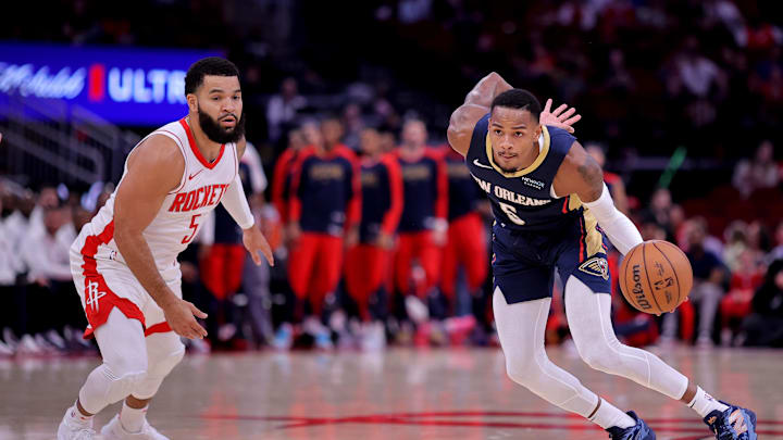 Oct 15, 2024; Houston, Texas, USA; New Orleans Pelicans guard Dejounte Murray (5) handles the ball against Houston Rockets guard Fred VanVleet (5) during the first quarter at Toyota Center. 