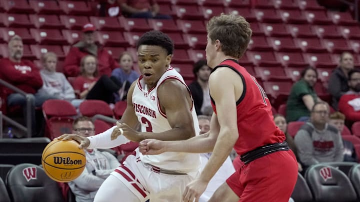 Wisconsin guard Camren Hunter (3) is guarded by UW-River Falls's Reggie Postel (14) during the second half of their preseason game Wednesday, October 30, 2024 at the Kohl Center in Madison, Wisconsin. Wisconsin beat UW-River Falls 78-62.