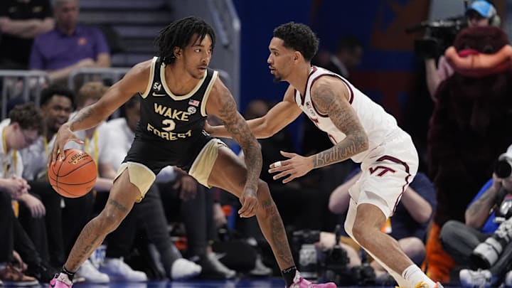 Mar 10, 2026; Charlotte, NC, USA; Wake Forest Demon Deacons forward Juke Harris (2) handles the ball guarded by Virginia Tech Hokies guard Jailen Bedford (0) during the first half at Spectrum Center. Mandatory Credit: Jim Dedmon-Imagn Images