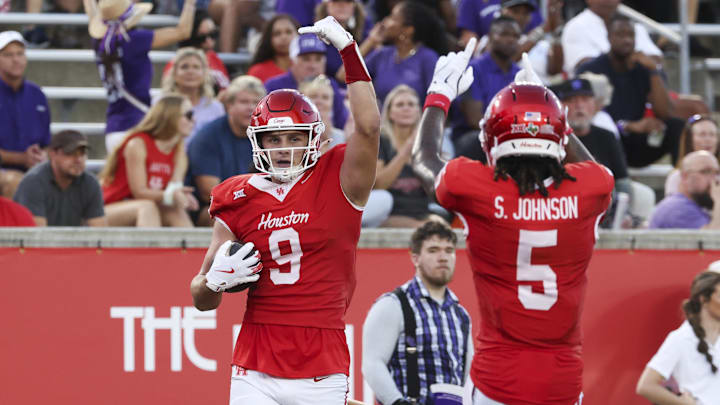 Aug 28, 2025; Houston, Texas, USA; Houston Cougars tight end Tanner Koziol (9) celebrates with wide receiver Stephon Johnson (5) after scoring a touchdown during the first quarter against the Stephen F. Austin Lumberjacks at TDECU Stadium. Mandatory Credit: Troy Taormina-Imagn Images