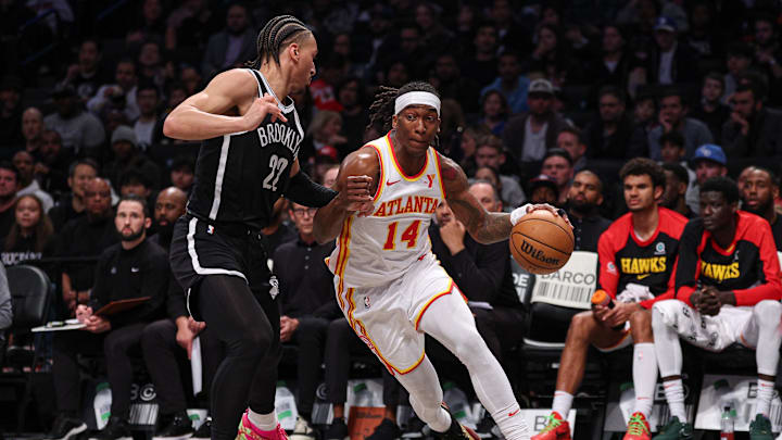 Mar 16, 2025; Brooklyn, New York, USA; Atlanta Hawks guard Terance Mann (14) goes to the basket as Brooklyn Nets forward Jalen Wilson (22) during the first half at Barclays Center. Mandatory Credit: Vincent Carchietta-Imagn Images Mar 16, 2025; Brooklyn, New York, USA; Atlanta Hawks guard Terance Mann (14) goes to the basket as Brooklyn Nets forward Jalen Wilson (22) during the first half at Barclays Center. Mandatory Credit: Vincent Carchietta-Imagn Images