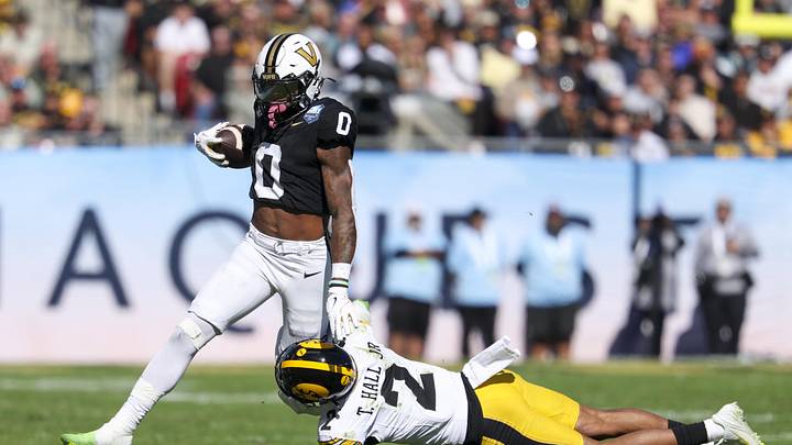 Dec 31, 2025; Tampa, FL, USA; Iowa Hawkeyes defensive back TJ Hall (2) trips up Vanderbilt Commodores wide receiver Junior Sherrill (0) in the second quarter during the ReliaQuest Bowl at Raymond James Stadium. Mandatory Credit: Nathan Ray Seebeck-Imagn Images Dec 31, 2025; Tampa, FL, USA; Iowa Hawkeyes defensive back TJ Hall (2) trips up Vanderbilt Commodores wide receiver Junior Sherrill (0) in the second quarter during the ReliaQuest Bowl at Raymond James Stadium. Mandatory Credit: Nathan Ray Seebeck-Imagn Images