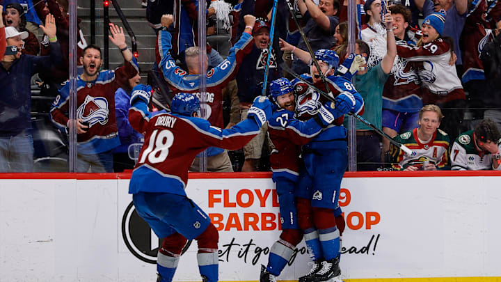 May 13, 2026; Denver, Colorado, USA; Colorado Avalanche defenseman Brett Kulak (27) celebrates his goal with center Martin Necas (88) and center Jack Drury (18) in overtime against the Minnesota Wild in game five of the second round of the 2026 Stanely Cup Playoffs at Ball Arena. Mandatory Credit: Isaiah J. Downing-Imagn Images