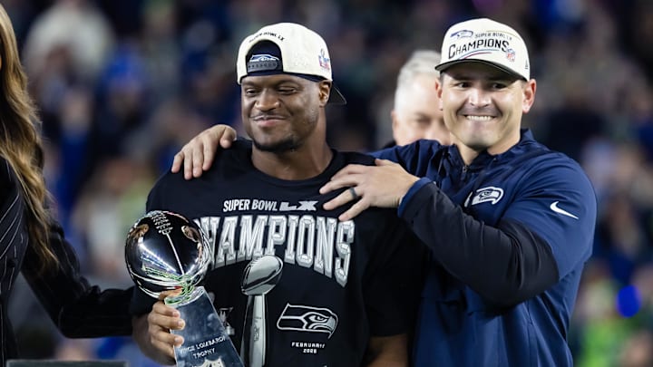 Feb 8, 2026; Santa Clara, CA, USA; Seattle Seahawks head coach Mike MacDonald and running back Kenneth Walker III (9) celebrate with the Vince Lombardi trophy after defeating the New England Patriots in Super Bowl LX at Levi's Stadium. Mandatory Credit: Mark J. Rebilas-Imagn Images