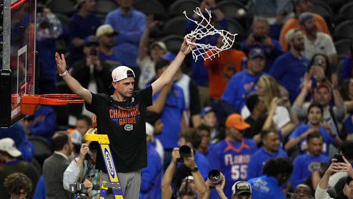 Apr 7, 2025; San Antonio, TX, USA; Florida Gators head coach Todd Golden reacts after cutting the net in the national championship game of the Final Four of the 2025 NCAA Tournament at the Alamodome.Mandatory Credit: Scott Wachter-Imagn Images