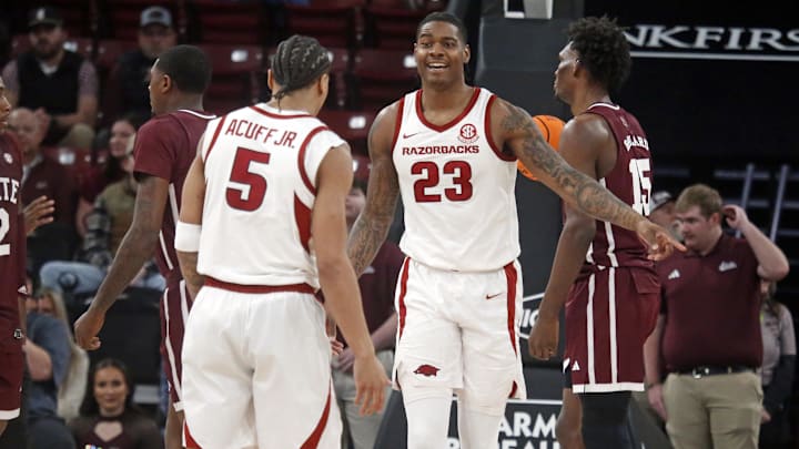 Feb 7, 2026; Starkville, Mississippi, USA; Arkansas Razorbacks forward Nick Pringle (23) reacts with guard Darius Acuff Jr. (5) during the second half against the Mississippi State Bulldogs at Humphrey Coliseum. Mandatory Credit: Petre Thomas-Imagn Images