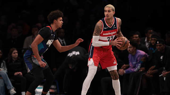 Nov 12, 2023; Brooklyn, New York, USA; Washington Wizards forward Kyle Kuzma (33) is guarded by Brooklyn Nets forward Cameron Johnson (2) during the first quarter at Barclays Center. Mandatory Credit: Vincent Carchietta-Imagn Images