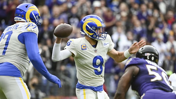 Jan 2, 2022; Baltimore, Maryland, USA; Los Angeles Rams quarterback Matthew Stafford (9) throws from the pocket during the first quarter as Baltimore Ravens outside linebacker Justin Houston (50) rushes  at M&T Bank Stadium. Mandatory Credit: Tommy Gilligan-Imagn Images