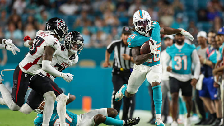 Aug 9, 2024; Miami Gardens, Florida, USA; Miami Dolphins running back Jaylen Wright (25) runs down the sideline against the Atlanta Falcons in the third quarter during preseason at Hard Rock Stadium. Mandatory Credit: Nathan Ray Seebeck-USA TODAY Sports