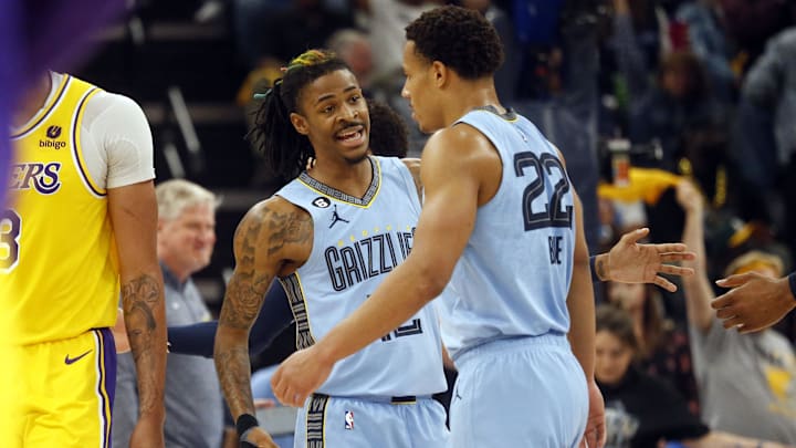 Apr 26, 2023; Memphis, Tennessee, USA; Memphis Grizzlies guard Ja Morant (12) reacts with guard Desmond Bane (22) during the first half against the Los Angeles Lakers during game five of the 2023 NBA playoffs at FedExForum. Mandatory Credit: Petre Thomas-Imagn Images