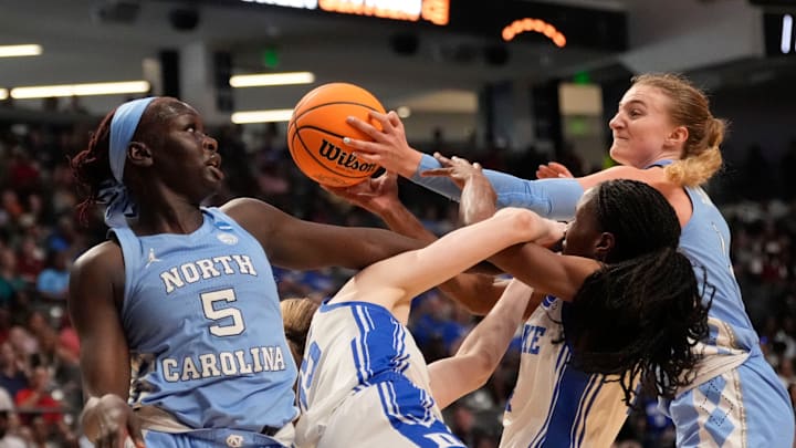 Mar 28, 2025; Birmingham, AL, USA; North Carolina Tar Heels center Maria Gakdeng (5) and North Carolina Tar Heels forward Alyssa Ustby (1) rebound agaisnt Duke Blue Devils guard Emma Koabel (15) and Duke Blue Devils forward Toby Fournier (35) at Legacy Arena in the Sweet 16. Duke advanced to the Elite 8 with a 47-38 victory. 