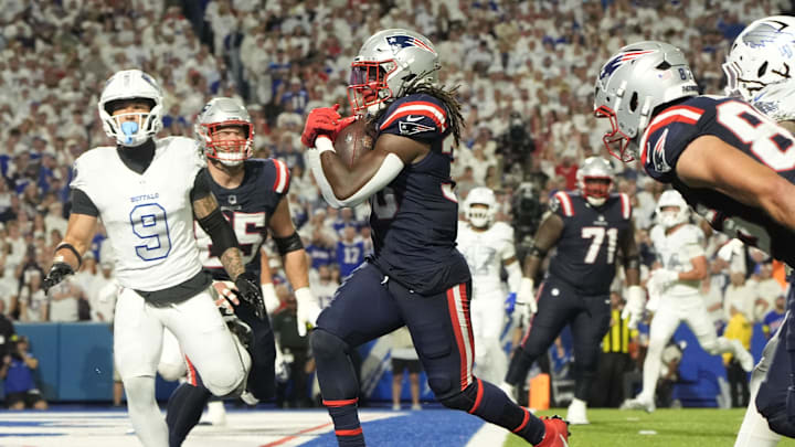 New England Patriots running back Rhamondre Stevenson (38) rushes for a touchdown against the Buffalo Bills during the second half at Highmark Stadium.