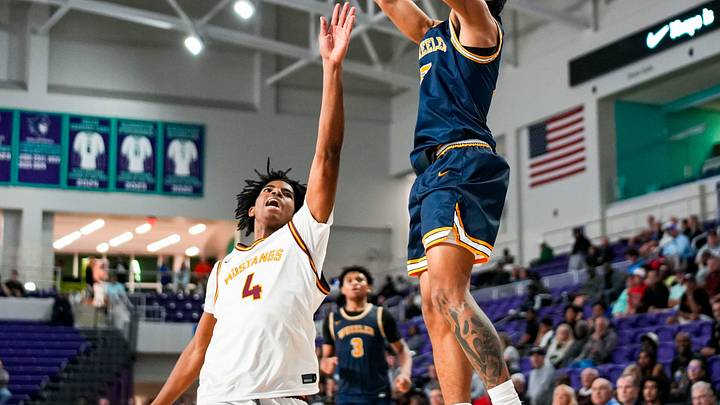 Wheeler Wildcats guard Kevin Savage III (2) shoots the ball.