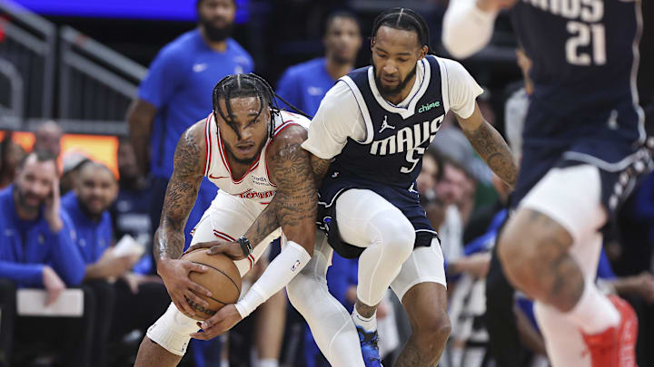 Mar 31, 2024; Houston, Texas, USA; Dallas Mavericks forward Derrick Jones Jr. (55) attempts to steal the ball from Houston Rockets forward Cam Whitmore (7) during the first half at Toyota Center. Mandatory Credit: Troy Taormina-Imagn Images