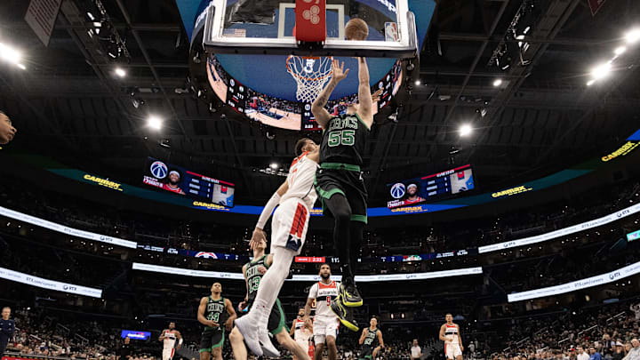USA; Boston Celtics forward Baylor Scheierman (55) shoots the ball as Washington Wizards forward Patrick Baldwin Jr. (7) defends in the second half at Capital One Arena. Mandatory Credit: Geoff Burke-Imagn Images