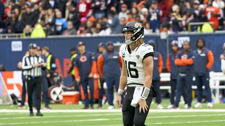 Oct 13, 2024; London, United Kingdom; Jacksonville Jaguars quarterback Trevor Lawrence (16) holds his leg during the second half of an NFL International Series game at Tottenham Hotspur Stadium. Mandatory Credit: Peter van den Berg-Imagn Images