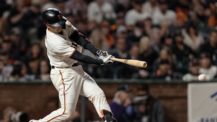 Sep 30, 2021; San Francisco, California, USA; San Francisco Giants catcher Buster Posey (28) hits an RBI double against the Arizona Diamondbacks in the fifth inning at Oracle Park. Mandatory Credit: John Hefti-Imagn Images