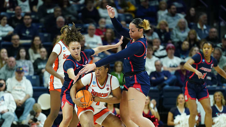 Mar 23, 2024; Storrs, Connecticut, USA; Arizona Wildcats guard Jada Williams (2) and forward Isis Beh (33) defends against Syracuse Orange guard Kennedi Perkins (1) in the first half at Harry A. Gampel Pavilion. Mandatory Credit: David Butler II-Imagn Images