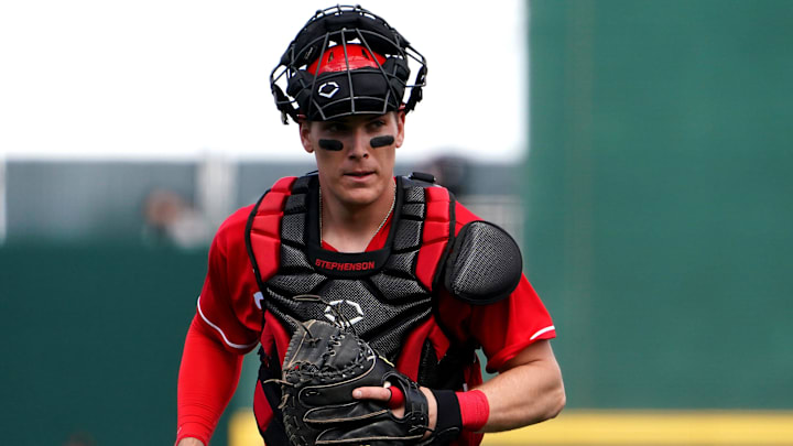 Cincinnati Reds catcher Tyler Stephenson (37) jogs back to behind the plate after a mound visit.