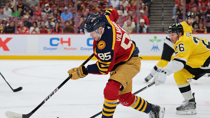 Feb 4, 2026; Sunrise, Florida, USA; Florida Panthers left wing Sandis Vilmanis (95) moves the puck against the Boston Bruins during the first period at Amerant Bank Arena. Mandatory Credit: Sam Navarro-Imagn Images