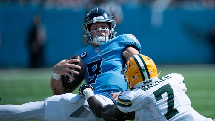 Green Bay Packers linebacker Quay Walker (7) tackles Tennessee Titans quarterback Will Levis (8) short of the first down on a fourth-down play in the third quarter during their game at Nissan Stadium in Nashville, Tenn., Sunday, Sept. 22, 2024. Green Bay Packers linebacker Quay Walker (7) tackles Tennessee Titans quarterback Will Levis (8) short of the first down on a fourth-down play in the third quarter during their game at Nissan Stadium in Nashville, Tenn., Sunday, Sept. 22, 2024.