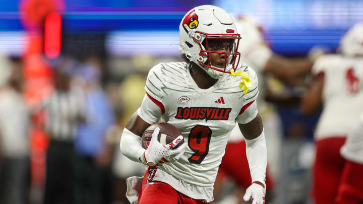 Sep 1, 2023; Atlanta, Georgia, USA; Louisville Cardinals wide receiver Ahmari Huggins-Bruce (9) runs the ball against the Georgia Tech Yellow Jackets in the second quarter at Mercedes-Benz Stadium. Sep 1, 2023; Atlanta, Georgia, USA; Louisville Cardinals wide receiver Ahmari Huggins-Bruce (9) runs the ball against the Georgia Tech Yellow Jackets in the second quarter at Mercedes-Benz Stadium.