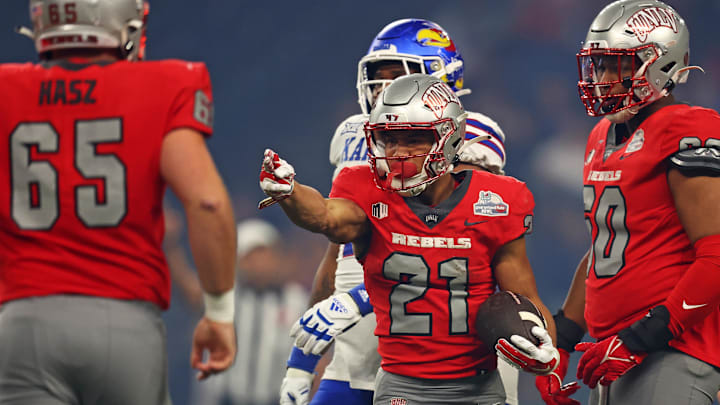 Dec 26, 2023; Phoenix, AZ, USA; UNLV Rebels wide receiver Jacob De Jesus (21) reacts after a play during the first quarter of the Guaranteed Rate Bowl against the Kansas Jayhawks at Chase Field. Mandatory Credit: Mark J. Rebilas-Imagn Images