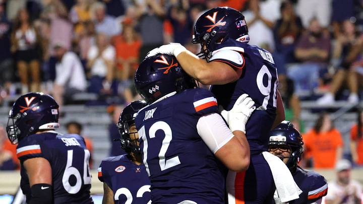Sep 11, 2026; Charlottesville, Virginia, USA; Virginia Cavaliers tight end Hayden Rollison (94) celebrates after scoring a touchdown during the fourth quarter against the Norfolk State Spartans at Scott Stadium. Mandatory Credit: Amber Searls-Imagn Images Sep 11, 2026; Charlottesville, Virginia, USA; Virginia Cavaliers tight end Hayden Rollison (94) celebrates after scoring a touchdown during the fourth quarter against the Norfolk State Spartans at Scott Stadium. Mandatory Credit: Amber Searls-Imagn Images