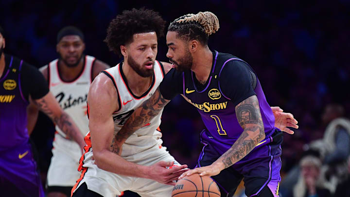 Dec 23, 2024; Los Angeles, California, USA; Los Angeles Lakers guard D'Angelo Russell (1) moves the ball against Detroit Pistons guard Cade Cunningham (2) during the first half at Crypto.com Arena. Mandatory Credit: Gary A. Vasquez-Imagn Images Dec 23, 2024; Los Angeles, California, USA; Los Angeles Lakers guard D'Angelo Russell (1) moves the ball against Detroit Pistons guard Cade Cunningham (2) during the first half at Crypto.com Arena. Mandatory Credit: Gary A. Vasquez-Imagn Images